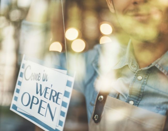 Small Business Open Sign through Window