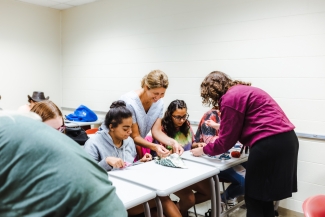 Upward Bound Students and instructor in Sewing Class