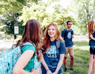 Four students talking