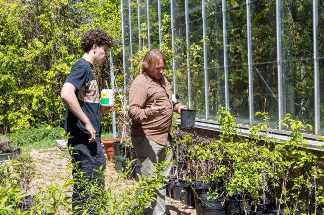 Student with Horticulture Instructor looking at trees